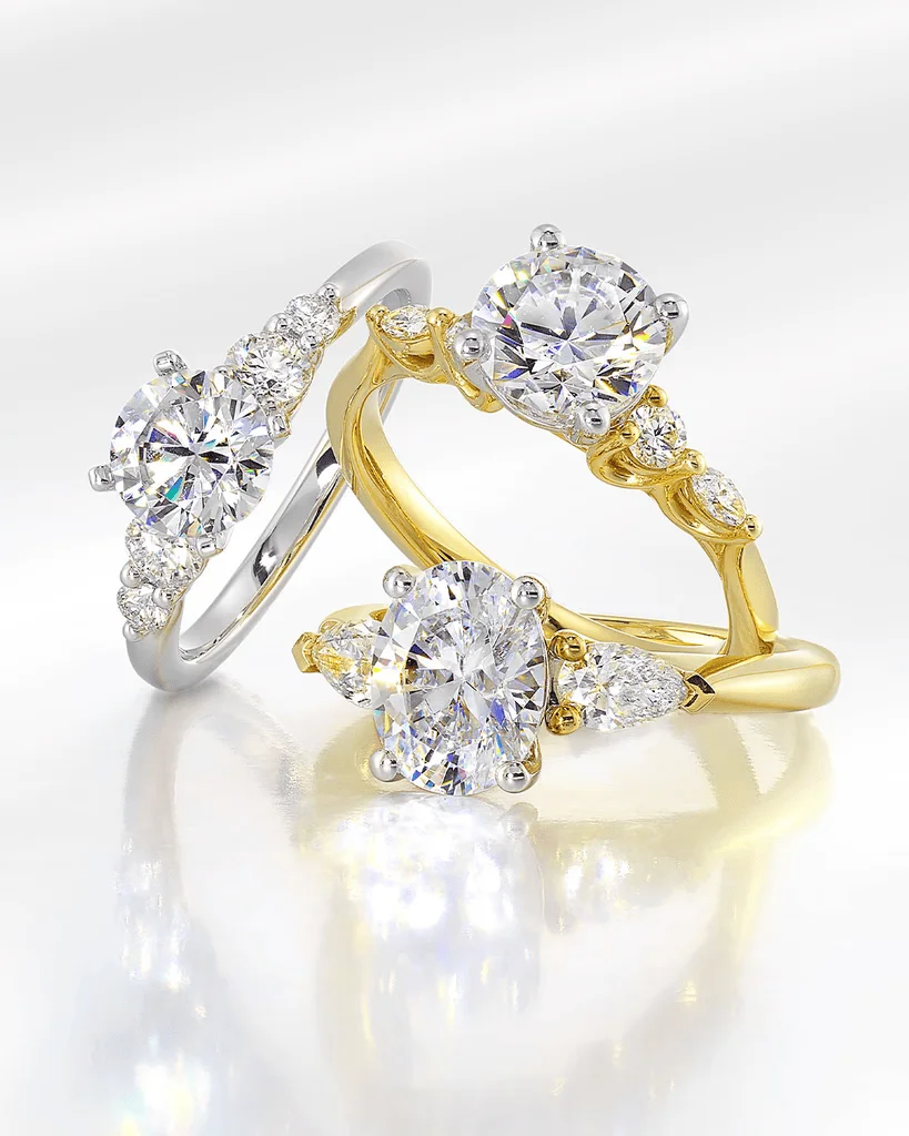 Gold and white gold engagement rings with accent side stones